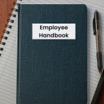 employee handbook on a desk